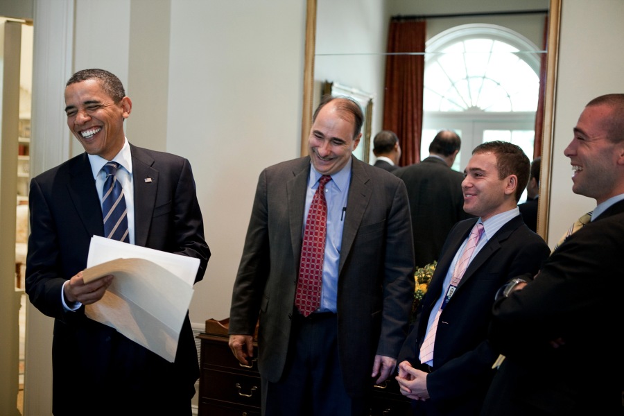 President Barack Obama laughs with, from left, Senior Advisor David Axelrod, Associate Director of Speechwriting Jonathan Lovett, and Director of Speechwriting Jon Favreau, while reading a draft of his remarks for the White House Correspondents Association dinner, in the Outer Oval Office, April 30, 2010. (Official White House Photo by Pete Souza)